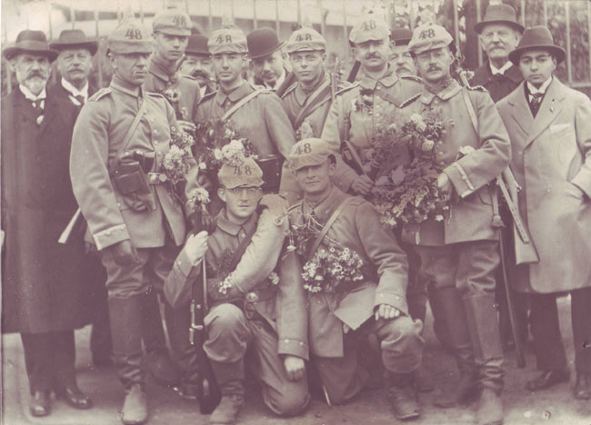 Gefreiter Arno Bierast (kneeling with blanket roll), great-grandfather of Andrew Lucas, about to depart Dresden for the Western Front with replacements for FAR 48 in October 1914