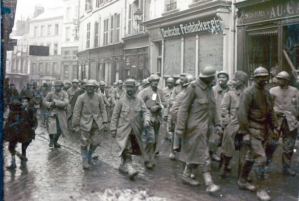 French prisoners taken by 23.ID on 10th March 1916 being escorted through the streets of Laon.